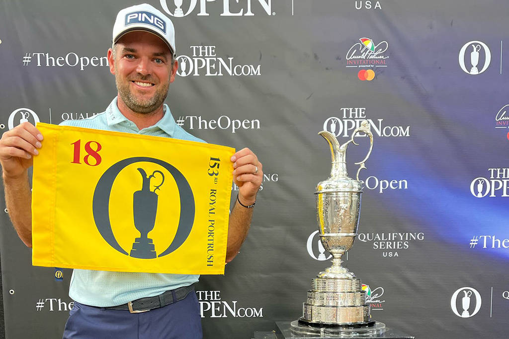 Corey Conners poses with the Claret Jug after qualifying for The 153rd Open
